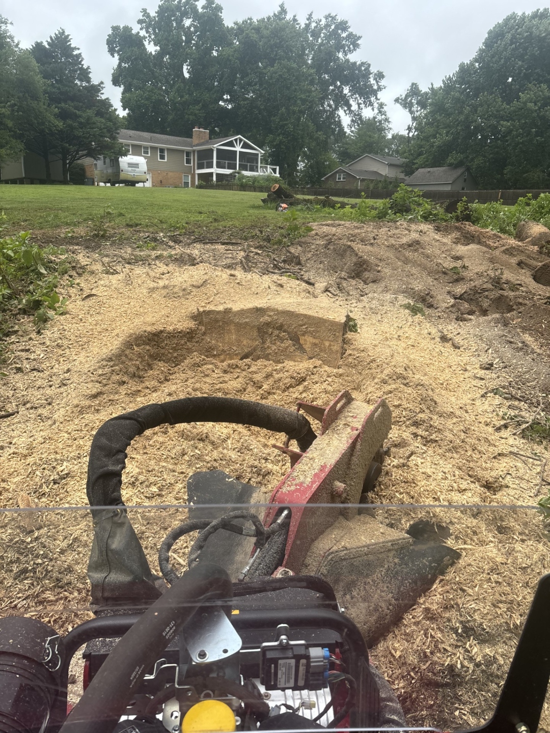 Stump grinder in action on a large lot clearing job